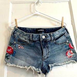 Jean cut off shorts with floral embroidery on sides. Size 6